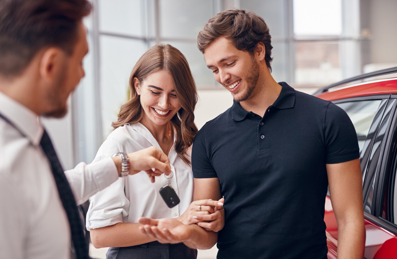 Happy Couple Purchasing First Vehicle Keys.jpg
