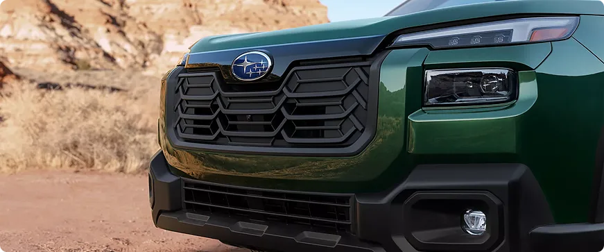 Close-up of the green Outback Wilderness front grille and badge