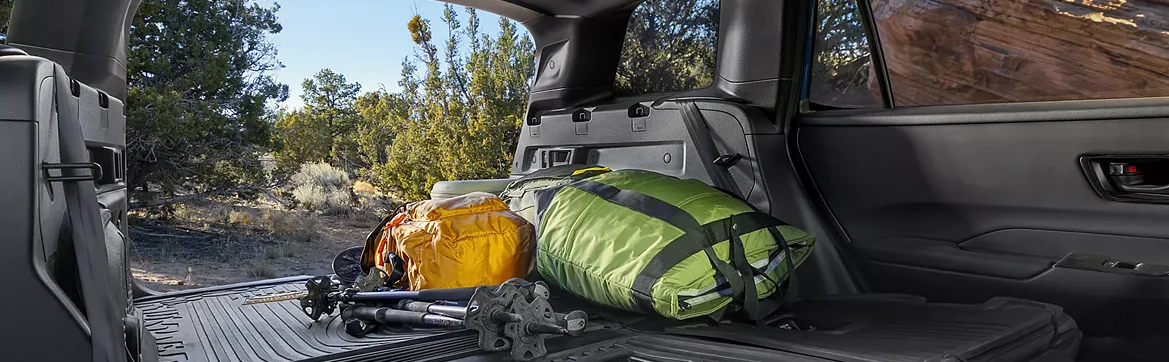 Rear cargo area of the Outback loaded with camping gear