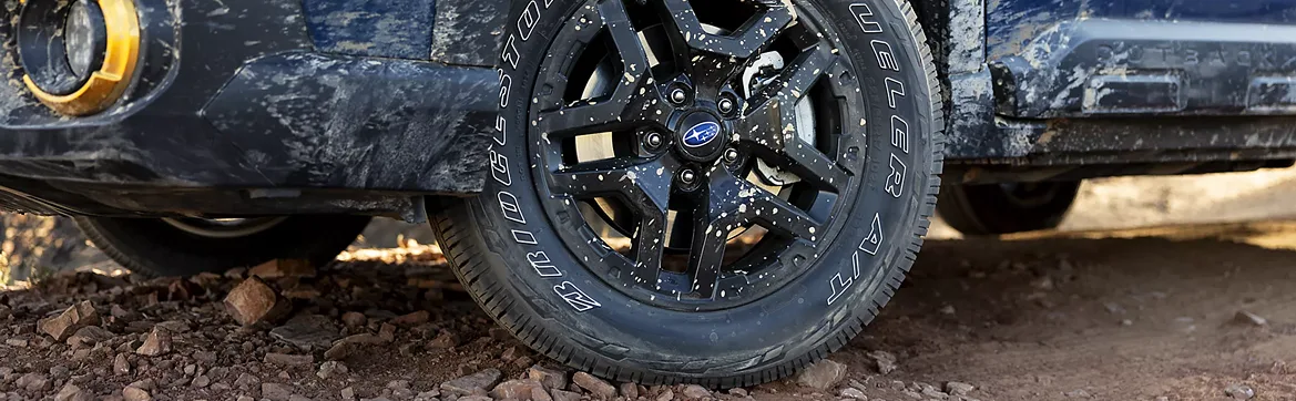 Black wheel with yellow accent on the Outback Wilderness in close-up