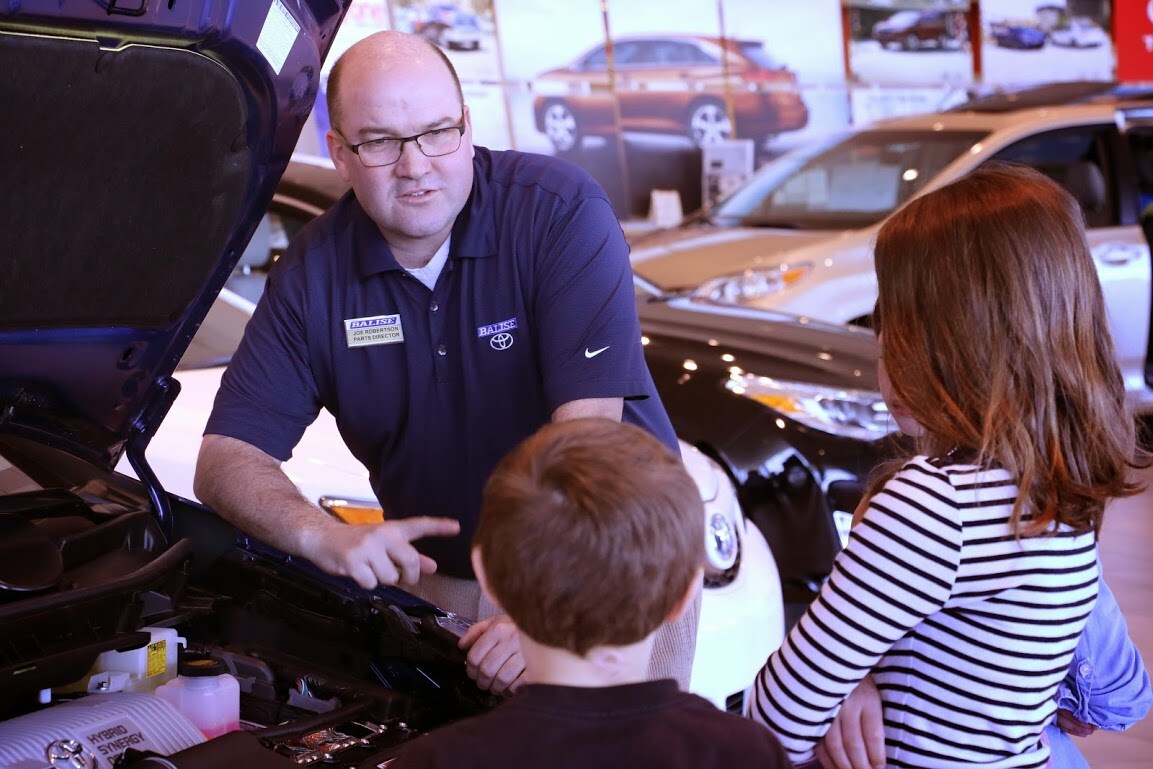 a service technician at Balise Toyota Scion of Warwick service tech at Balise Toyota Scion of Warwick explaining oil changes