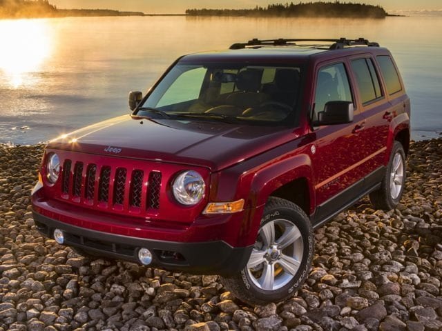 2017 Jeep Patriot red on rocks by lake.jpg