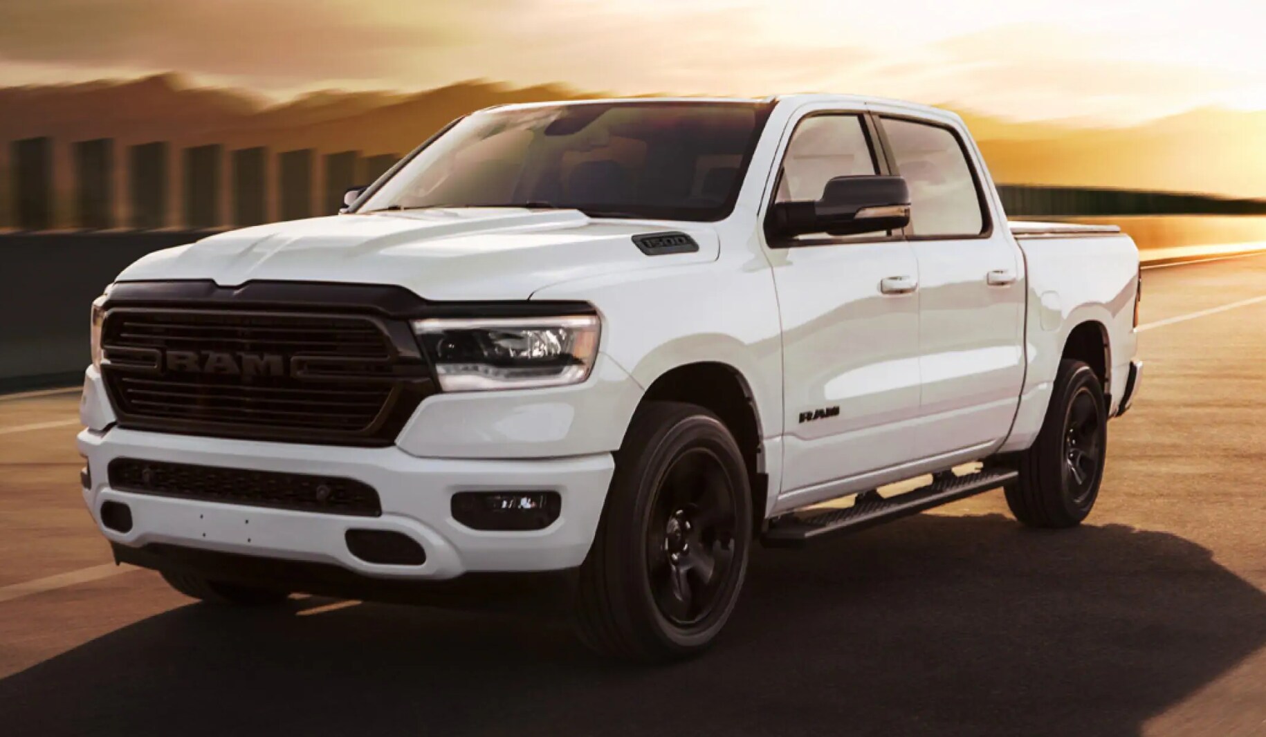2021 Ram 1500 driving down a highway.png