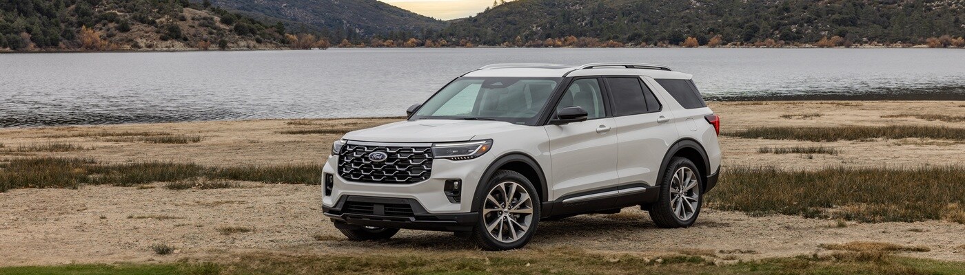 Ford Explorer White Ford Explorer parked beside a lake