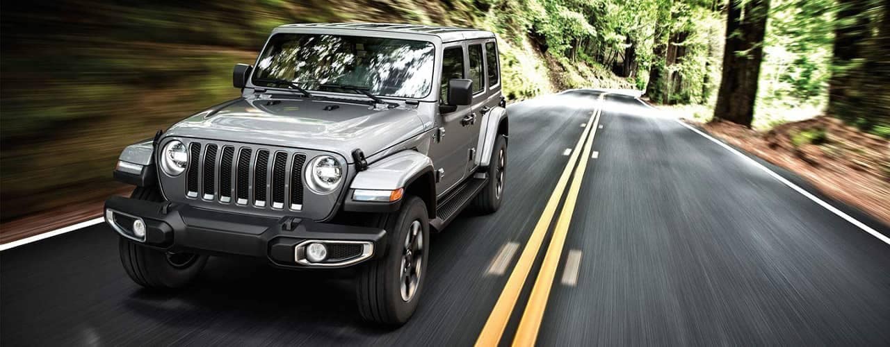 Jeep Wrangler Driving On Street.jpg
