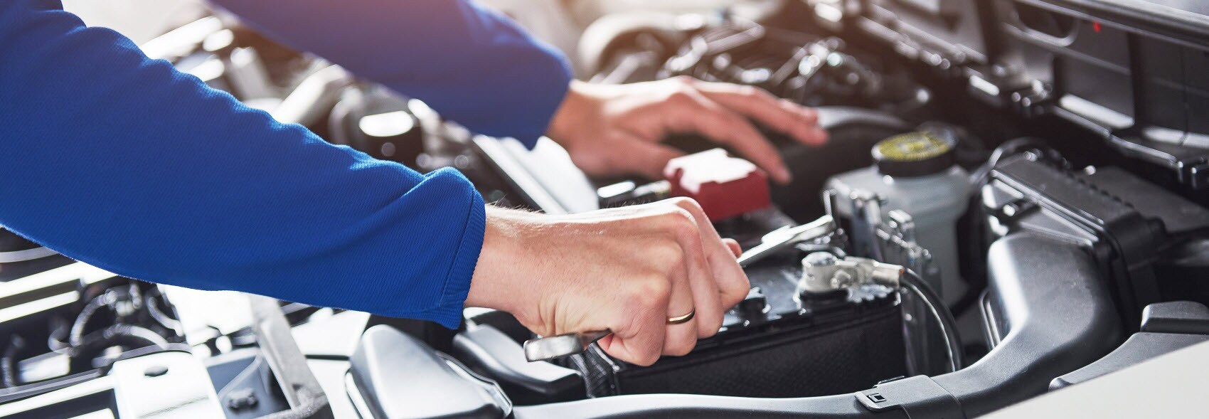 Mechanic Working on Nissan Vehicle