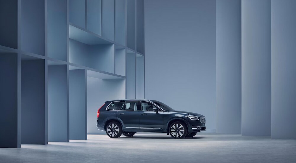 Side view of a blue 2024 Volvo XC90 at a Volvo dealer near Rutland.