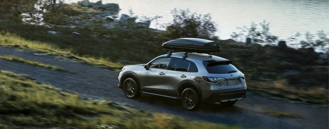 Overhead view of a silver 2024 Honda HR-V Sport driving on a dirt trail.