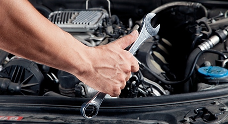 Photo of Beechmont Toyota's factory trained technician performing service on a customer's vehicle equipment