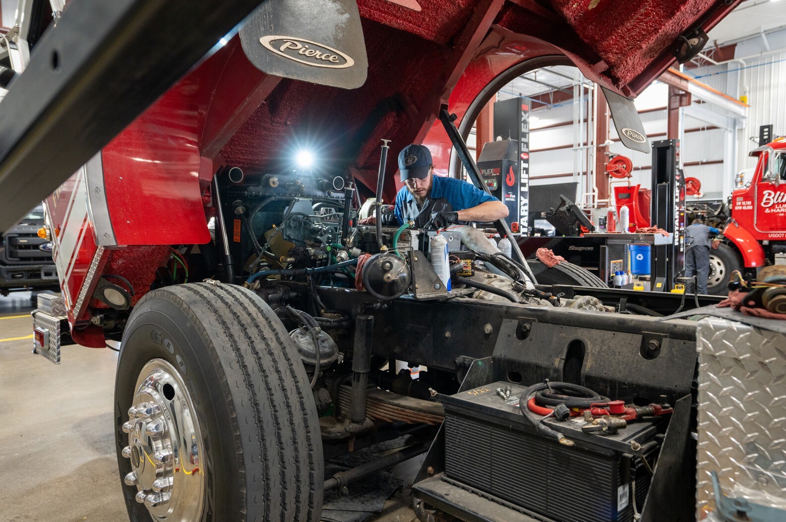 Ford service technician working on vehicle
