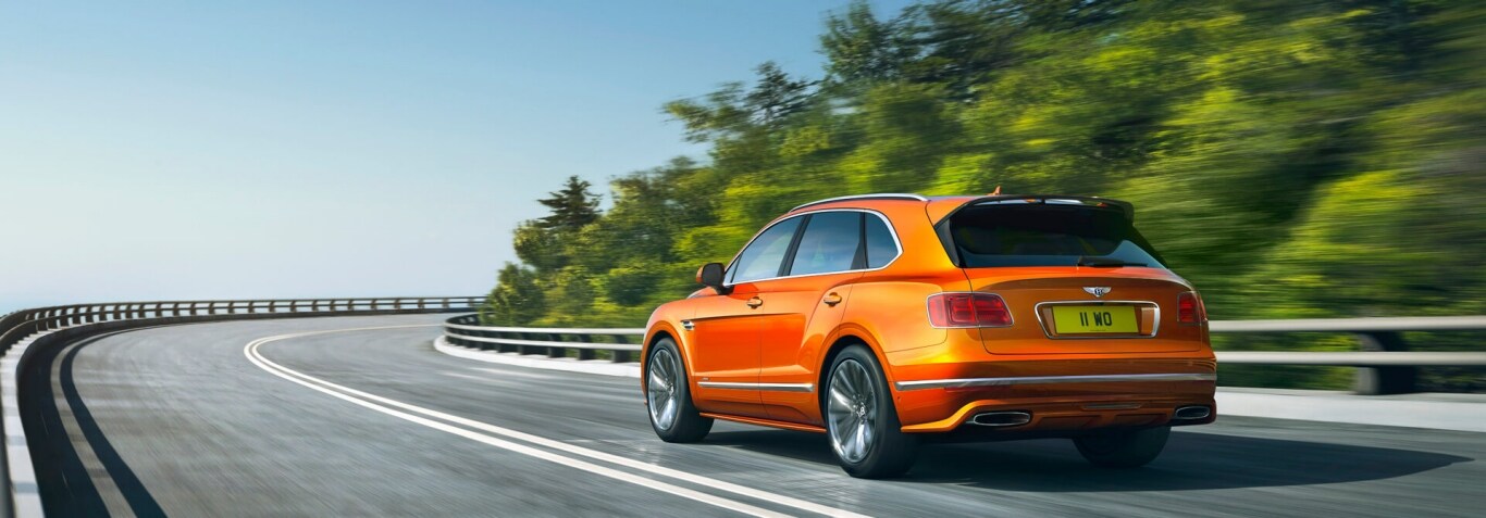 bentayga-speed-driving-dynamically-around-mountain-bend-1920x670.jpg