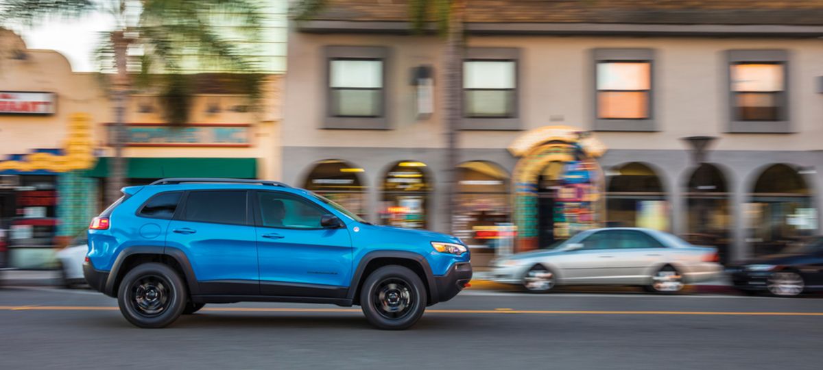 2021 Jeep Cherokee TrailHawk WheelAddOn SUV blue driving past city markets_res.jpeg