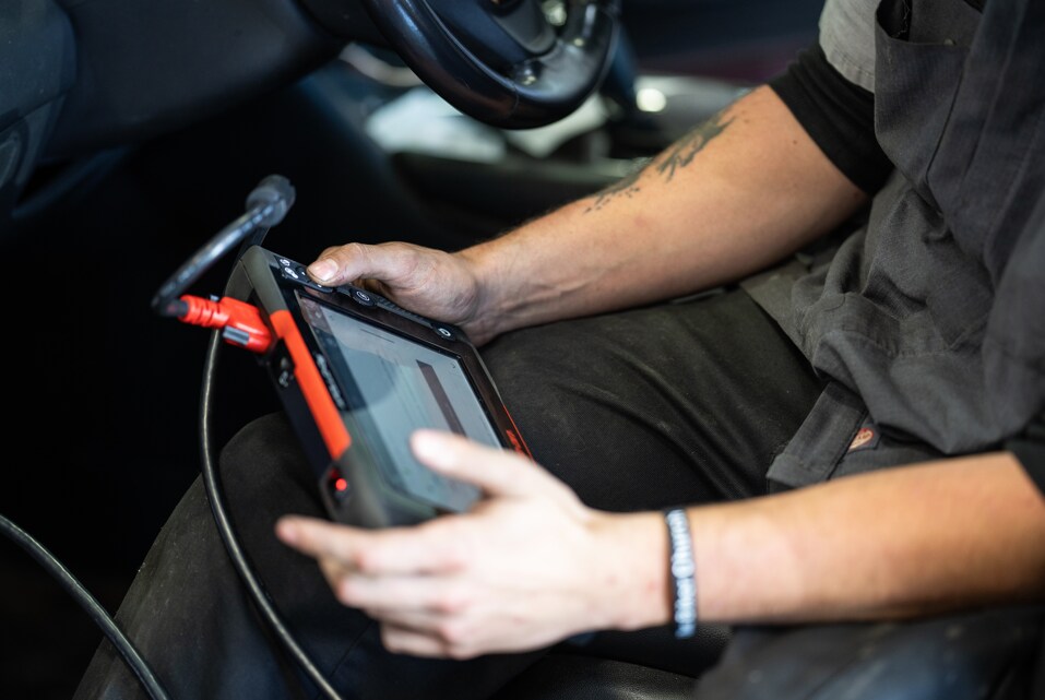 Technician performing preventative maintenance inspection