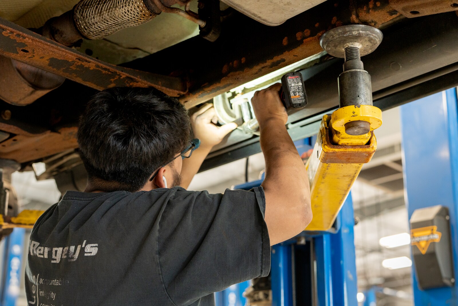 Technician performing an additional vehicle inspection