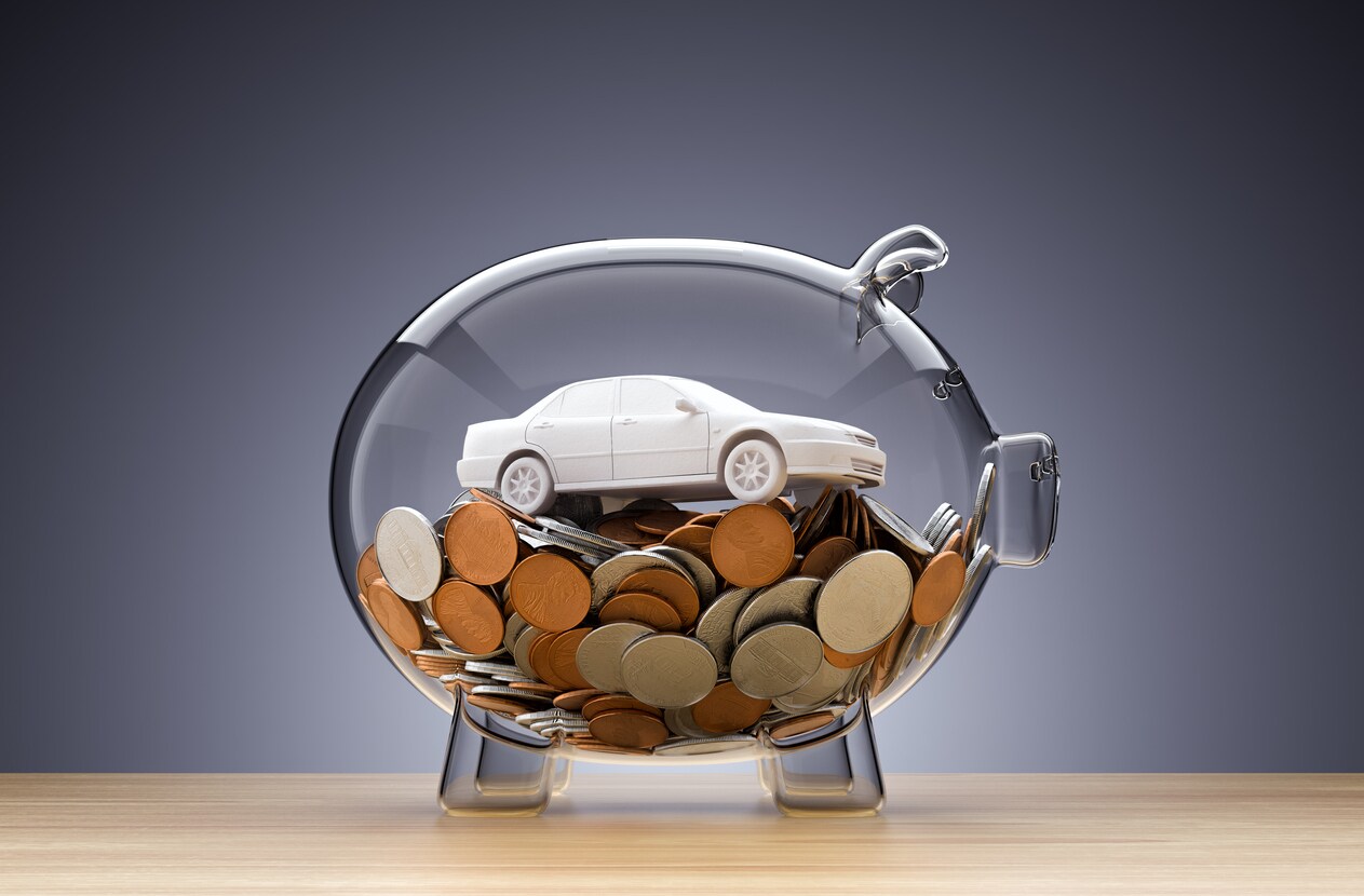 Clear Piggy Bank with Change and Car Model Inside