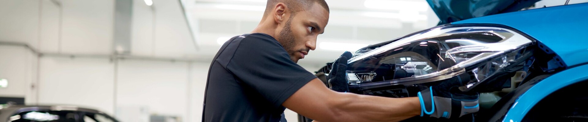 Certified BMW Technician working on a new BMW in our BMW Auto Service Center