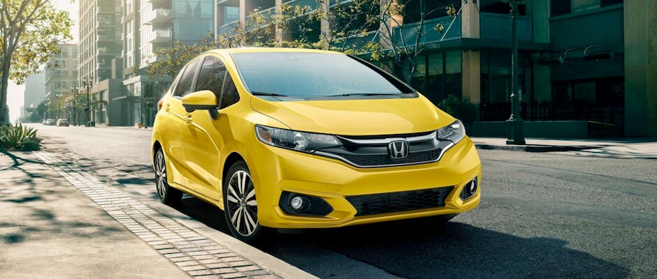 2018 Honda Fit Trim Review A yellow 2018 Honda Fit parked on the street