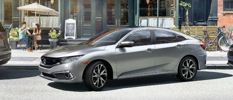 Silver 2019 Honda Civic parking outside cafe