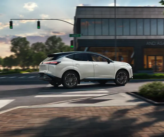 Nissan Murano at a city intersection, a two-row SUV for Tacoma drivers who do not need a third row