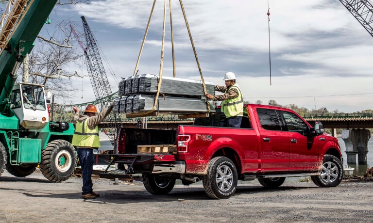 2019 Ford F-150 loading heavy payload from crane