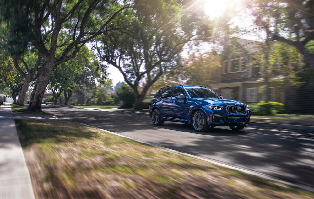 Shop from Home at BMW of Bel Air | 2020 BMW X3 driving through suburb