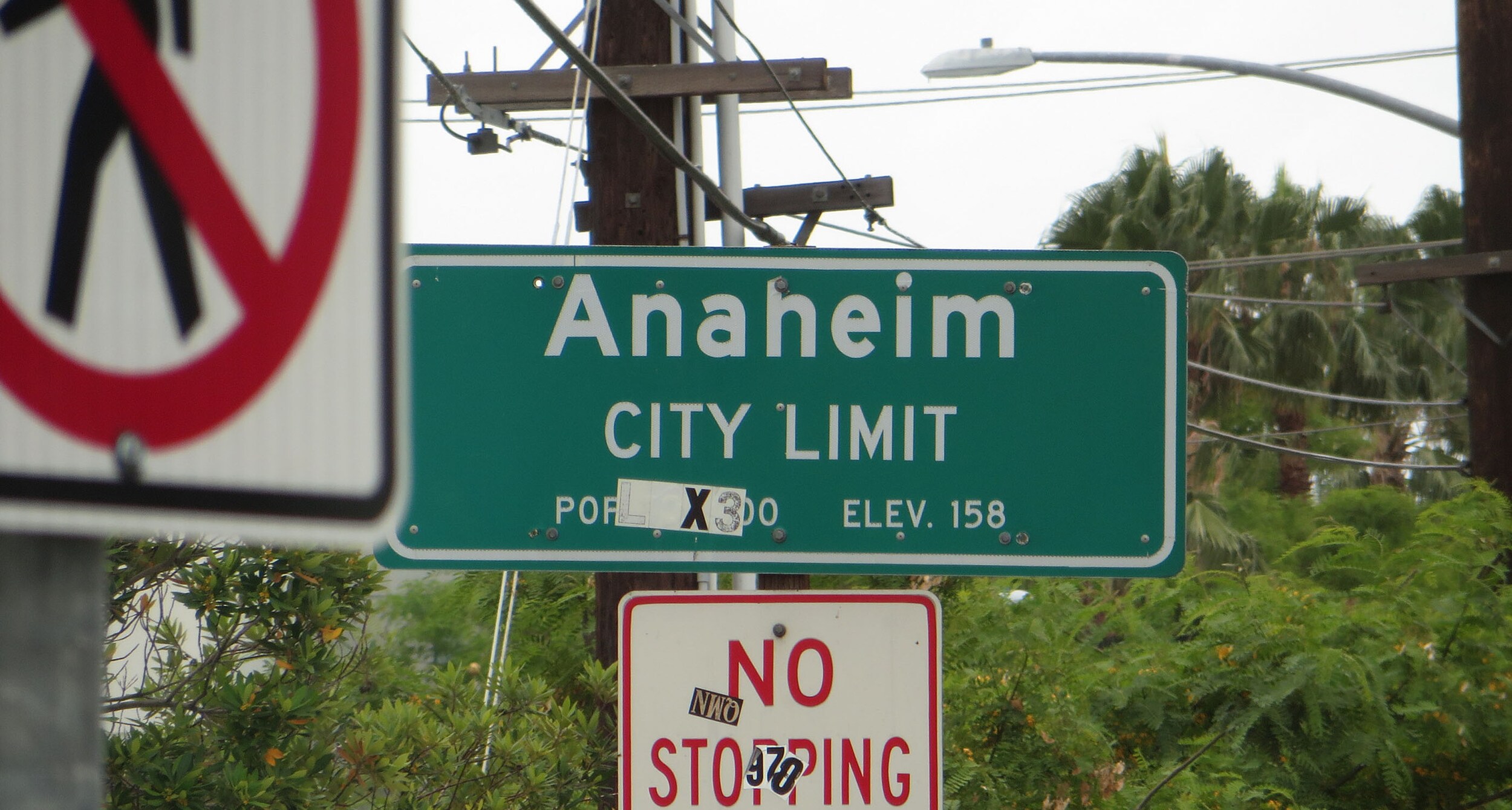 Street sign showing Anaheim, CA City Limits