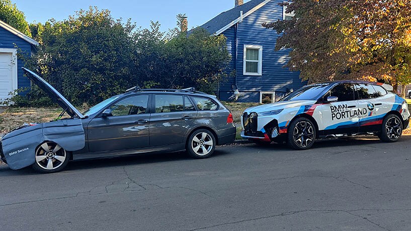 BMW Portland Mobile Recall Service. BMW Wagon parked on the street in front of a home being repaired.