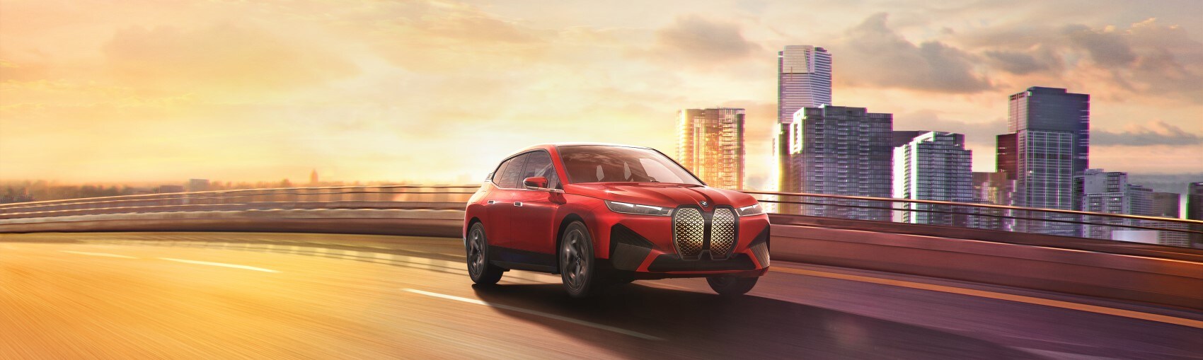 2022 BMW iX EV red driving on highway skyline in background.jpg