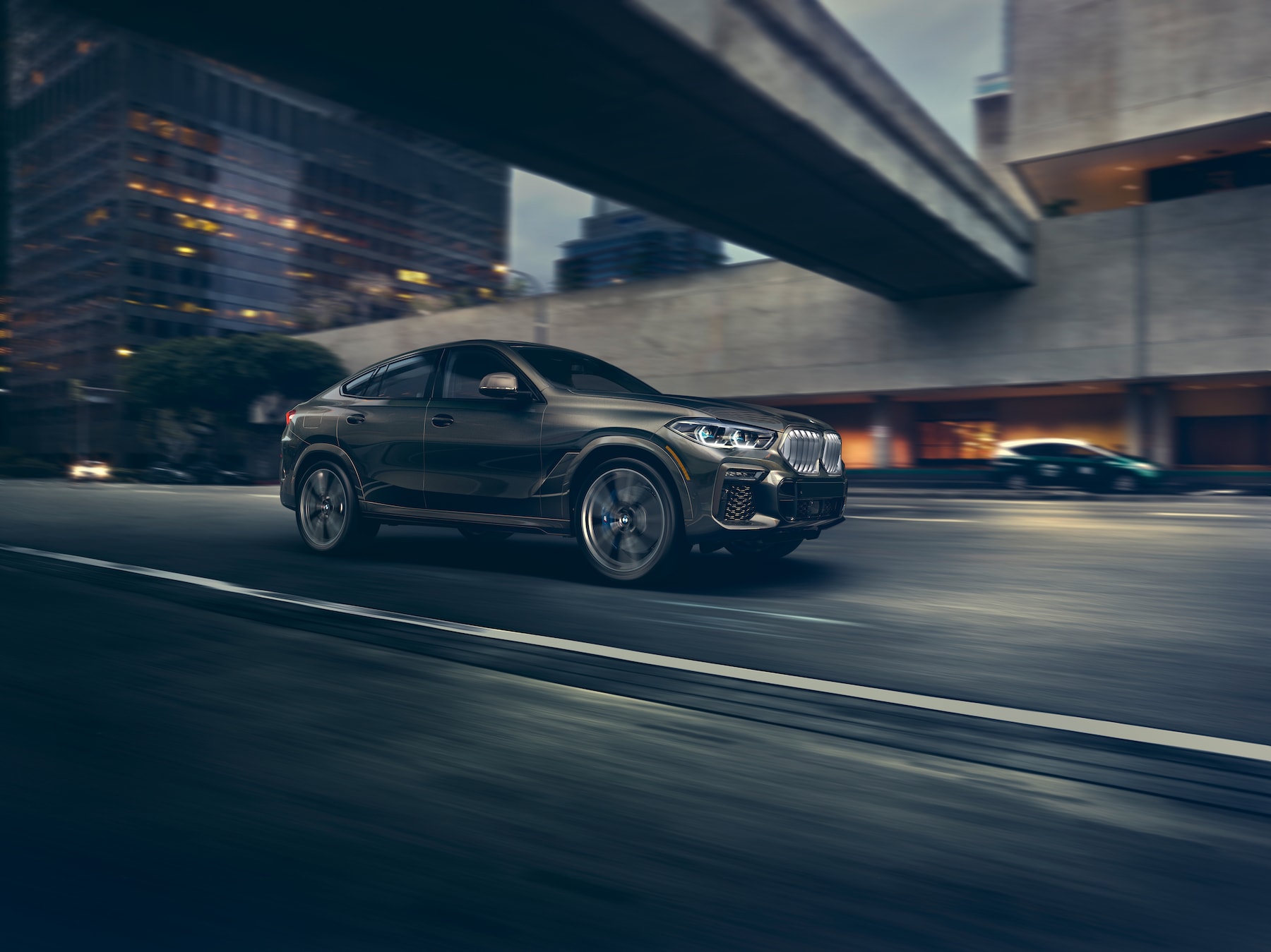 BMW of Rockville is a car dealership near Montgomery Village, MD | 2020 BMW X6 driving in city