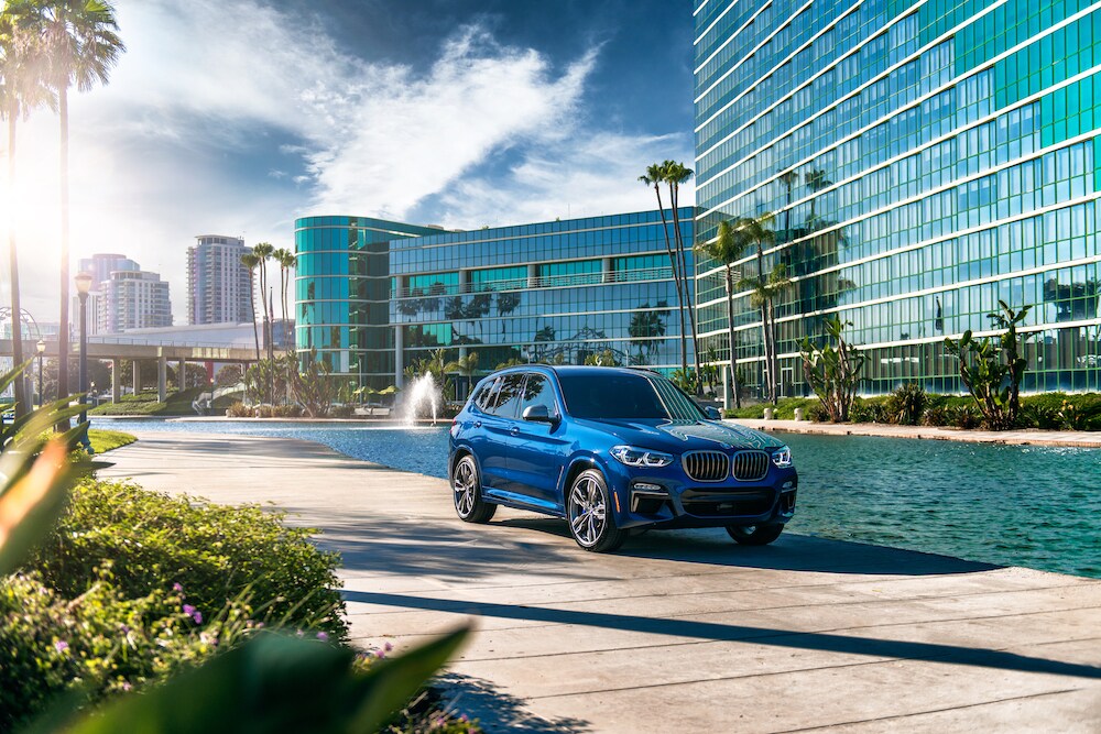 BMW of Rockville is a car dealership near Montgomery Village, MD | 2020 BMW X3 in front of resort