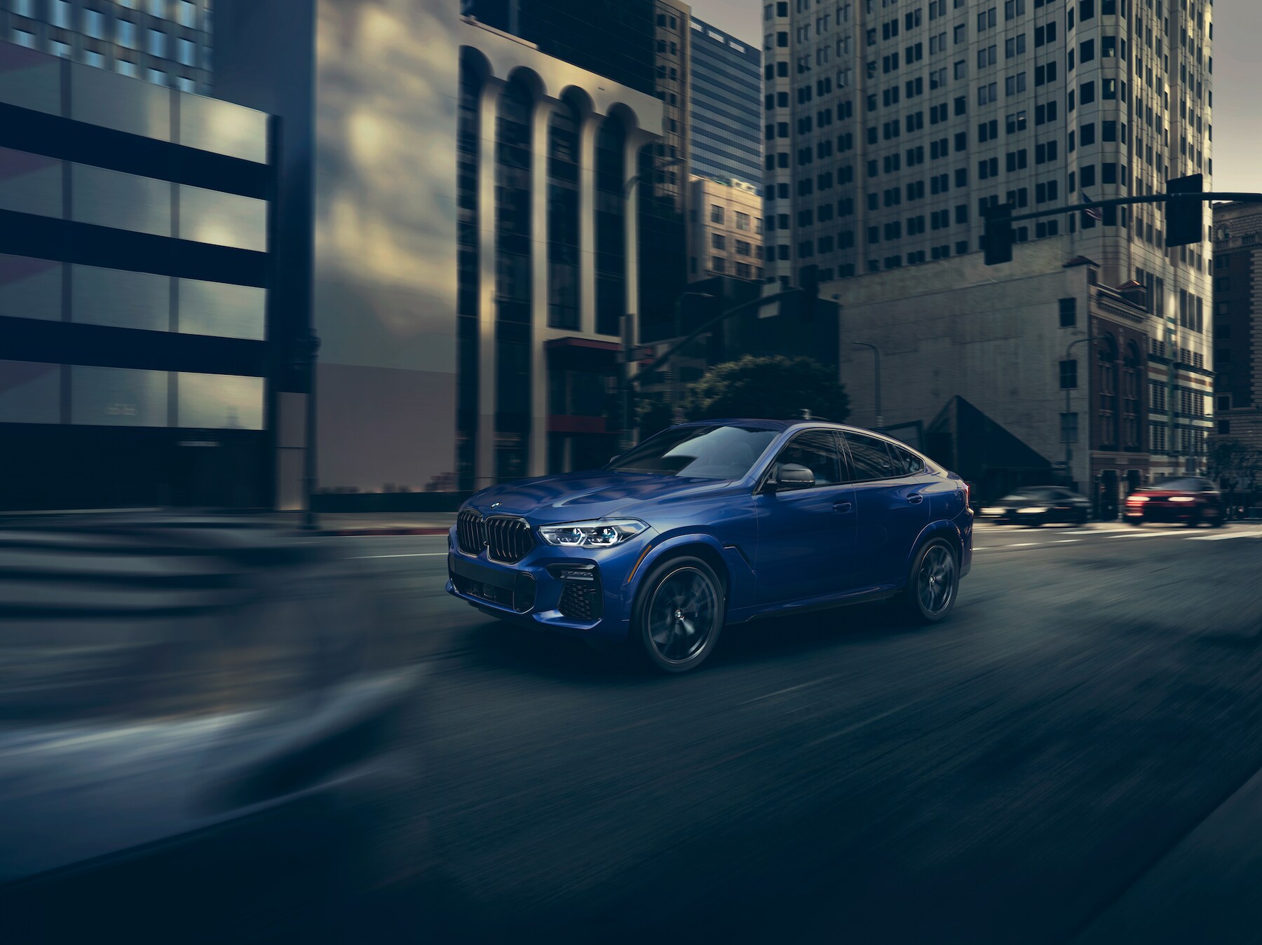 Model features of the 2020 X7 at BMW of Rockville | Blue 2020 BMW X6 running on road Model features of the 2020 X7 at BMW of Rockville | Blue 2020 BMW X6 running on road
