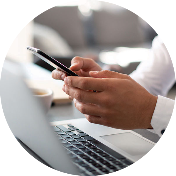 Tell us about your vehicle A person sitting at a table with a phone in their hands.