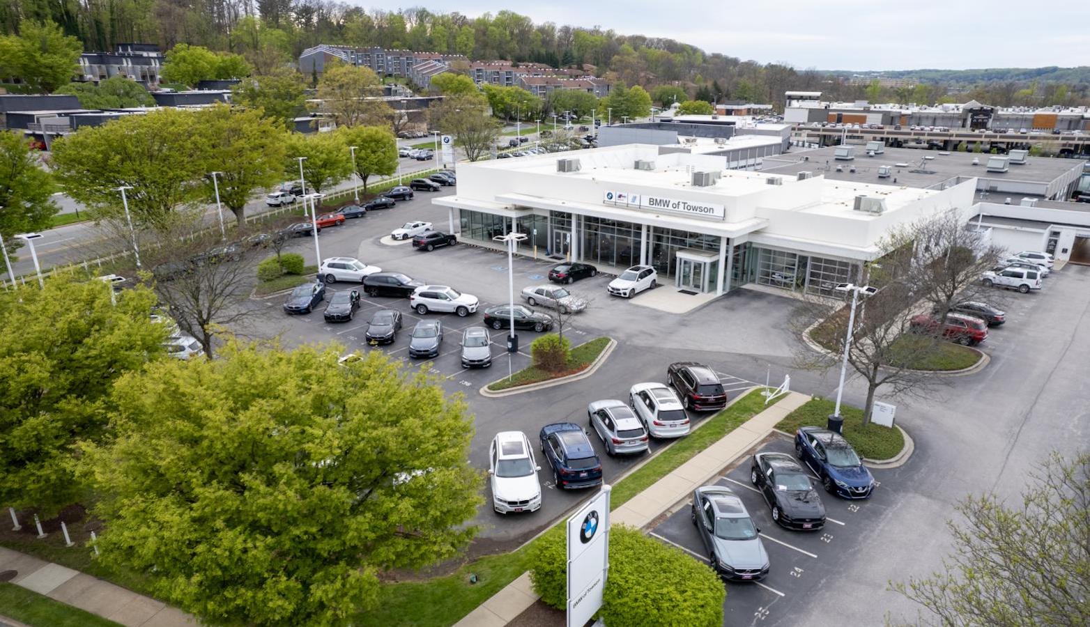 Learn more about BMW of Towson in Towson, MD Aerial exterior shot of BMW of Towson on a clear sprint or summer day