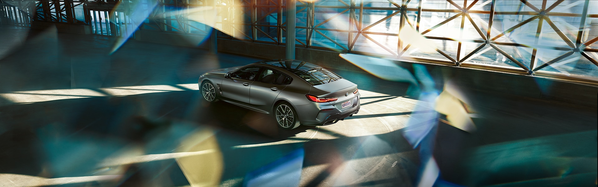 BMW of Towson is a BMW Dealership near Baldwin MD | 2020 BMW 8 Series parked in building with refracted light overlay