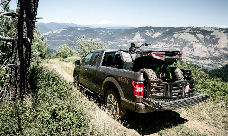 2020 Ford F-150 with an ATV in the bed