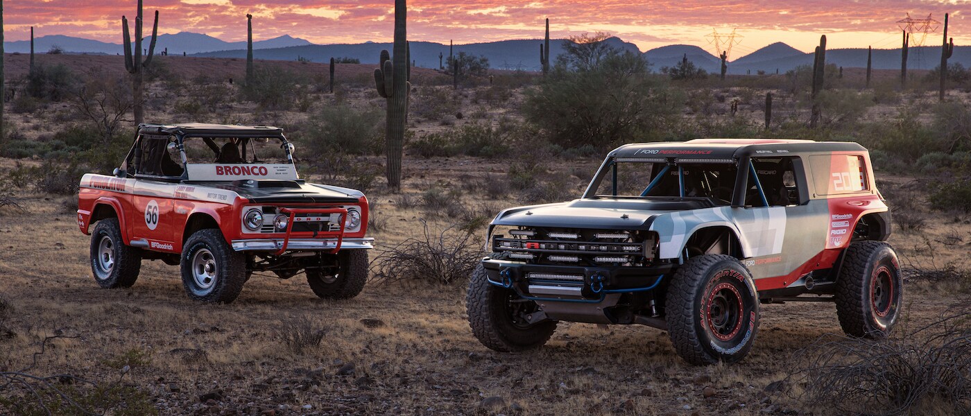 Ford Bronco Two old ford Broncos parked in the desert