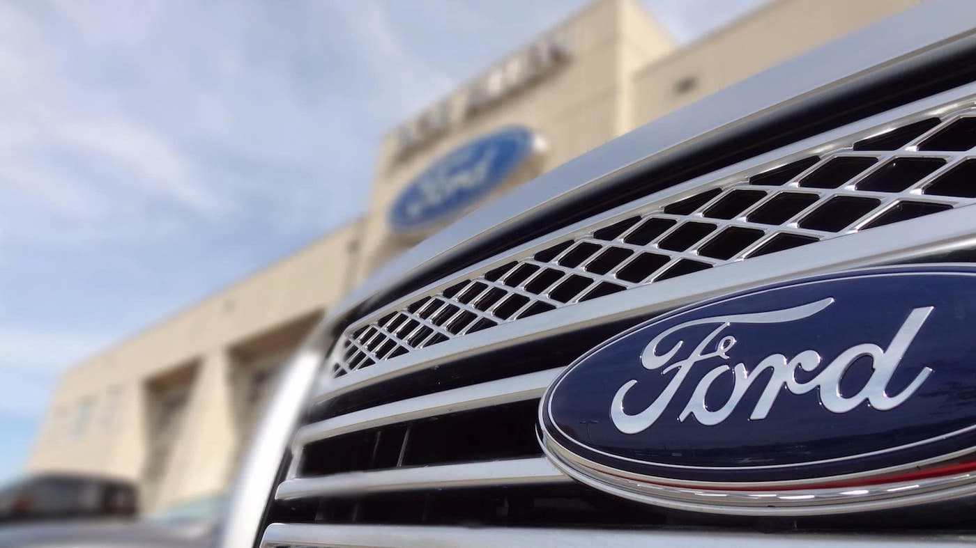 Bob Allen Ford The front end of a Ford truck in front of Bob Allen Ford