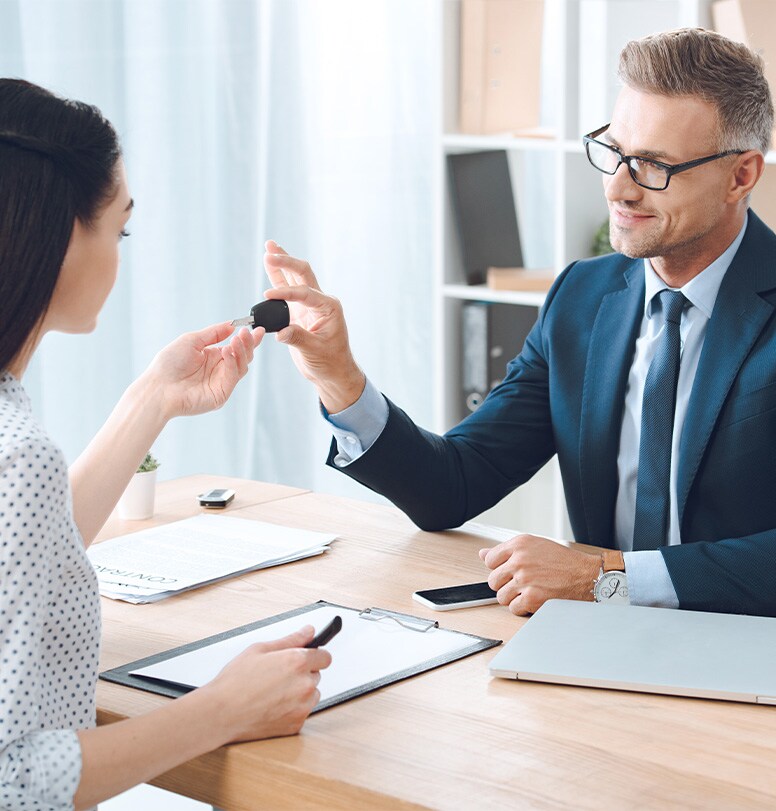 Defining GAP Insurance at Bobby Rahal Acura in Mechanicsburg | Finance Advisor Handing Car Keys Over to Customer