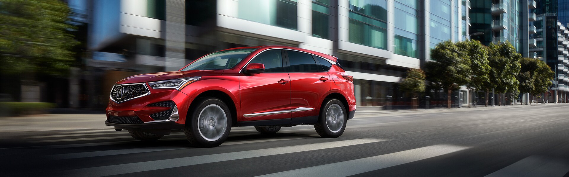 Benefits of Changing Your Acura’s Oil at Bobby Rahal Acura in Mechanicsburg | Red RDX Driving Through City