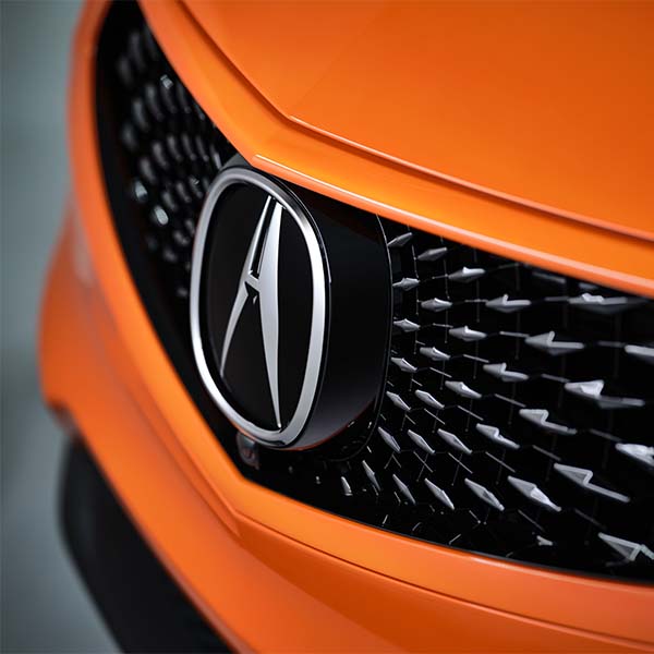 Model Features of the 2021 Acura RDX at Bobby Rahal Acura | Grille & Front Badging on an Orange 2021 Acura RDX