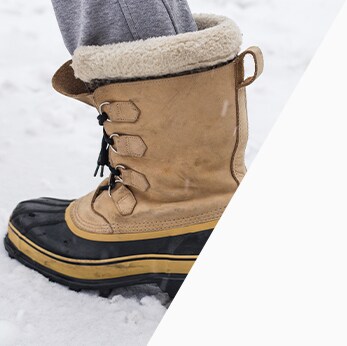 How to prepare your Acura for the winter season in Mechanicsburg, PA at Bobby Rahal Acura | Close-up boot being used to walk in snow