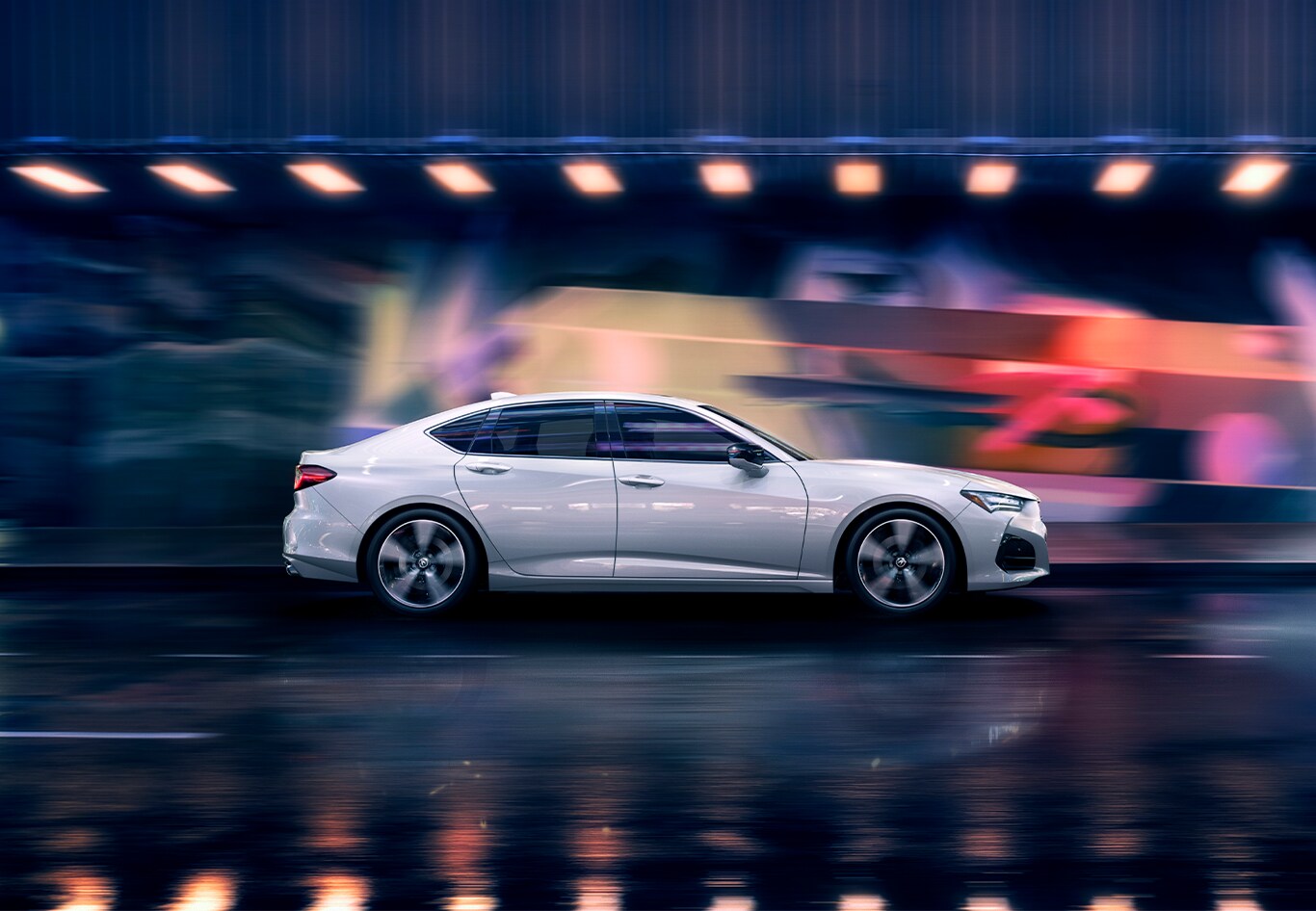 Android Auto vs. Apple CarPlay at Bobby Rahal Acura in Mechanicsburg, PA | White Acura TLX driving down the street