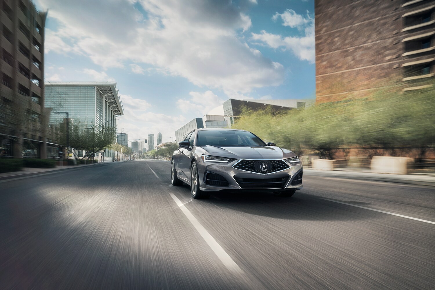 Bobby Rahal Acura is a Car Dealership near Enola PA | 2021 Acura TLX driving downtown