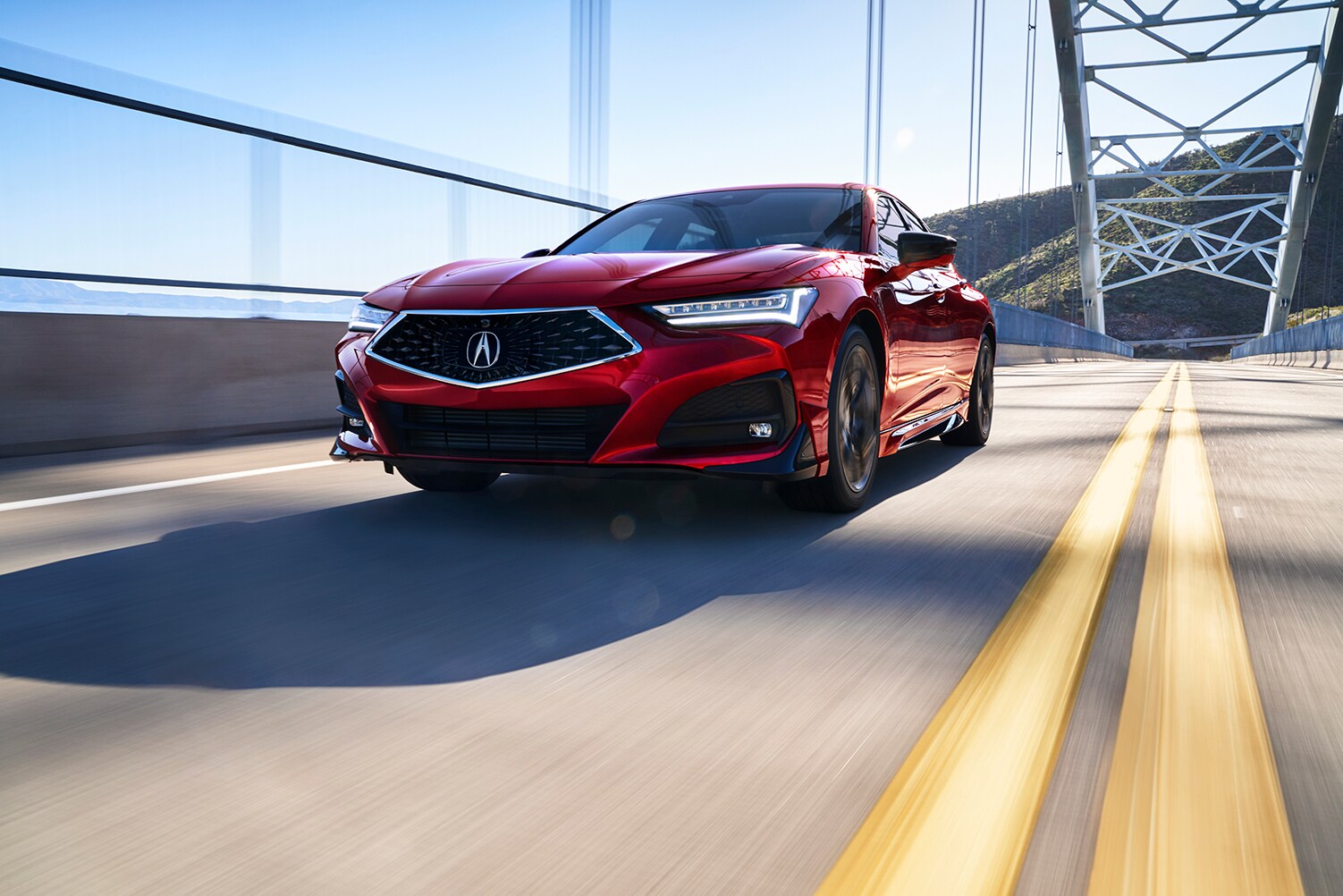 The 2021 Acura TLX vs. The 2022 Acura TLX at Bobby Rahal Acura | 2021 Acura TLX driving on bridge