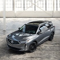 Compare the 2020 Acura MDX and the 2022 Acura MDX at Bobby Rahal Acura | MDX parked in showroom