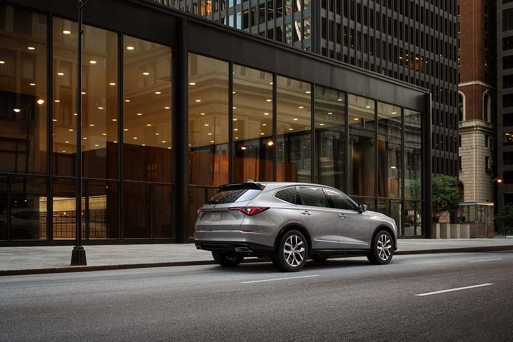 Why drivers should consider an extended warranty on their Acura at Bobby Rahal Acura | 2022 Acura MDX parked on the side of the street next to a building
