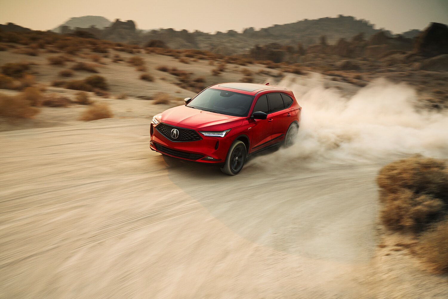 Bobby Rahal Acura is a Car Dealership near Enola PA | 2022 Acura MDX driving on a dirt road