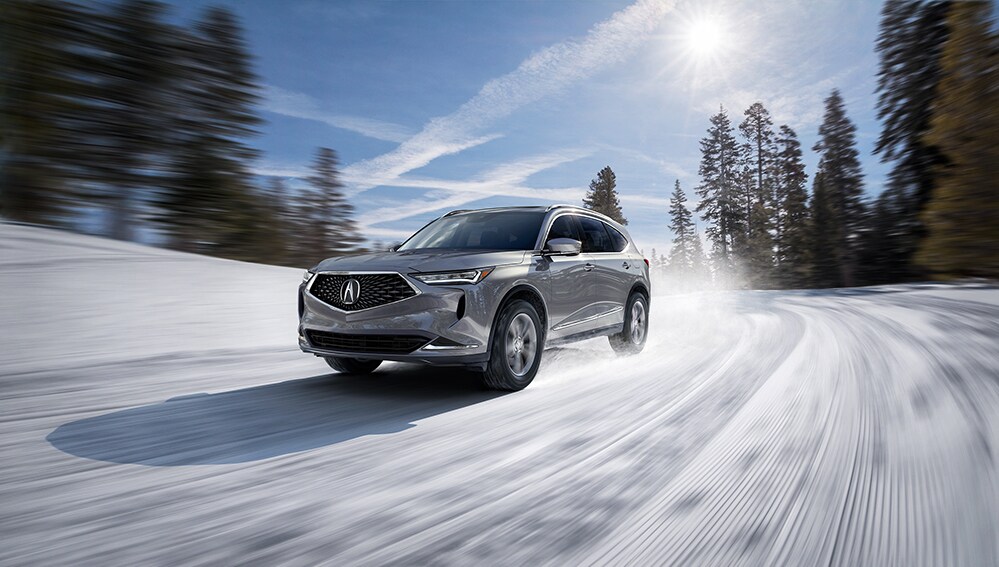 How to prepare your Acura for the winter season in Mechanicsburg, PA at Bobby Rahal Acura | 2022 Acura MDX driving in the snow