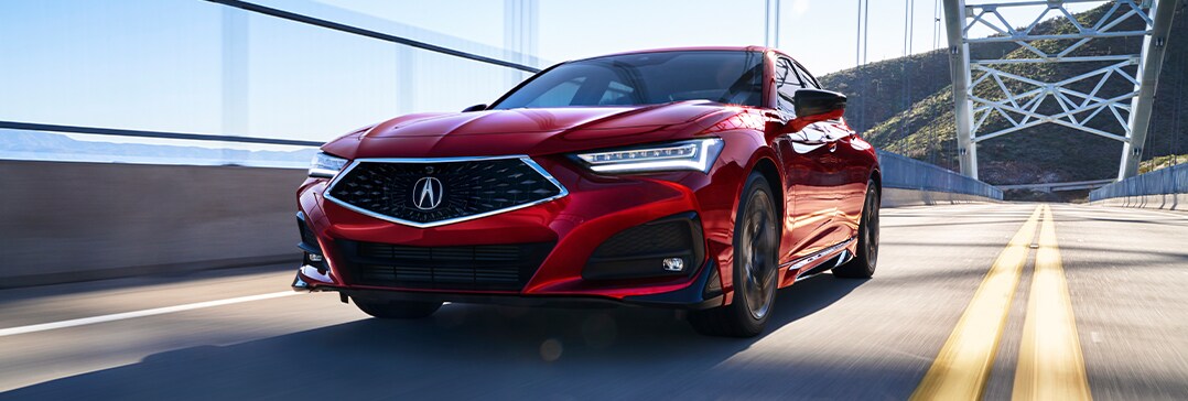Model Features of the 2021 Acura TLX at Bobby Rahal Acura | TLX driving fast on bridge