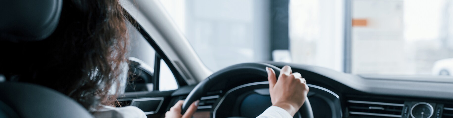 Remove Dead Bugs From Front of Cars at Bobby Rahal Acura in Mechanicsburg, PA | Rear seat view of woman driving her car